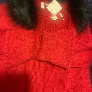 Red and black sweater jacket. Detachable Black fur collar.